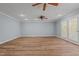 Bright and airy living room showcasing updated flooring, neutral paint, and glass patio doors at 74 Dove Trl Trl, Sanford, NC 27332