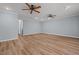 Spacious living room featuring updated flooring, ceiling fans, and neutral paint at 74 Dove Trl Trl, Sanford, NC 27332