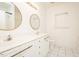 Bright bathroom features double vanities, modern fixtures, and classic white tile at 906 Stuart Dr, Mebane, NC 27302