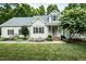 Charming single-Gathering home features a well-manicured lawn, welcoming front porch, and traditional architecture at 906 Stuart Dr, Mebane, NC 27302