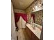 Full bathroom with vanity sink, wallpaper, and shower/tub combo at 9160 Old Cascade Road Dr, Garner, NC 27529