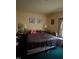 Neutral bedroom with a comfortable bed, side tables, and dresser at 9160 Old Cascade Road Dr, Garner, NC 27529