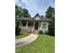 Charming single-story home featuring a covered porch, brick foundation and well-maintained lawn at 9160 Old Cascade Road Dr, Garner, NC 27529