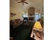 Cozy living room featuring a stone fireplace, vaulted ceiling, and neutral-toned furniture at 9160 Old Cascade Road Dr, Garner, NC 27529