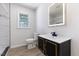 Modern bathroom with a sleek vanity, contemporary mirror and glass enclosed shower at 1020 Benning St, Durham, NC 27703