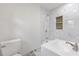 Tiled bathroom featuring a combination shower and tub with updated fixtures at 1020 Benning St, Durham, NC 27703