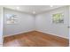 Bright bedroom featuring hardwood floors, recessed lighting, and double windows at 1020 Benning St, Durham, NC 27703