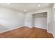 Spacious bedroom with hardwood floors, recessed lighting, and a walk-in closet at 1020 Benning St, Durham, NC 27703