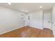 Spacious bedroom featuring hardwood floors and two doors for separate areas at 1020 Benning St, Durham, NC 27703