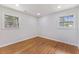 Bedroom featuring hardwood floors, recessed lighting, and double windows at 1020 Benning St, Durham, NC 27703