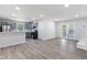 Open layout features a modern kitchen leading into a spacious living area at 1020 Benning St, Durham, NC 27703