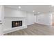 Spacious living room with wood floors, fireplace, and recessed lighting throughout at 1020 Benning St, Durham, NC 27703