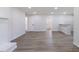 Large living area with wood floors, white fireplace, and neutral walls at 1020 Benning St, Durham, NC 27703