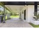 Covered patio with a ceiling fan offers a shaded outdoor space for relaxing and entertaining at 1020 Benning St, Durham, NC 27703