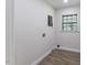 Image of a room with wood floors, neutral walls, and a bright window view at 1020 Benning St, Durham, NC 27703
