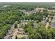 Community aerial view displays wooded areas, ponds, and easy access to local amenities at 137 Cricketgrass Dr, Cary, NC 27513