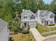 Drone shot showcasing the property with a manicured lawn and surrounding trees at 137 Cricketgrass Dr, Cary, NC 27513