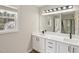 Bathroom featuring a double vanity with white countertops and modern fixtures at 137 Cricketgrass Dr, Cary, NC 27513