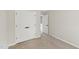 View of a bedroom featuring neutral walls, carpet, and a double door closet at 137 Cricketgrass Dr, Cary, NC 27513