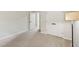 Carpeted bedroom featuring closet with double doors and overhead lighting at 137 Cricketgrass Dr, Cary, NC 27513