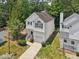 Aerial view of a well-maintained home with a driveway and green landscaping at 137 Cricketgrass Dr, Cary, NC 27513