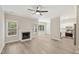 Open-concept living area with hardwood floors, fireplace, and seamless access to the kitchen at 137 Cricketgrass Dr, Cary, NC 27513