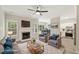 Bright, staged living room featuring a fireplace, hardwood floors, and comfortable seating at 137 Cricketgrass Dr, Cary, NC 27513