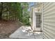 Exterior view of a patio area next to the home surrounded by greenery at 137 Cricketgrass Dr, Cary, NC 27513