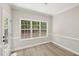 Bright room with large windows offering a view of the surrounding greenery at 137 Cricketgrass Dr, Cary, NC 27513