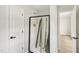 Bathroom featuring black framed glass shower doors and tile surround at 137 Cricketgrass Dr, Cary, NC 27513