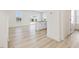 Open-concept living area with modern flooring, abundant natural light, and seamless flow to kitchen at 138 Favored Avenue, Sanford, NC 27330