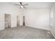 Spacious bedroom with neutral carpet, two entry doors and a window at 220 Needle Park Dr, Cary, NC 27513