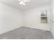 Well lit bedroom with carpet, white walls and ceiling fan at 220 Needle Park Dr, Cary, NC 27513