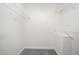 Walk-in closet with shelving and neutral colored carpet at 220 Needle Park Dr, Cary, NC 27513