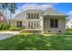Home back exterior features large windows, and an outdoor patio area perfect for relaxing or entertaining guests at 321 Wescott Ridge Dr, Holly Springs, NC 27540