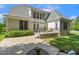 Back of home featuring a patio with seating area, lush lawn, and well-maintained landscaping at 321 Wescott Ridge Dr, Holly Springs, NC 27540