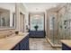 Updated bathroom featuring dual vanity and frameless glass shower at 321 Wescott Ridge Dr, Holly Springs, NC 27540