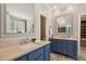 Dual vanity bathroom featuring tile floors and under-cabinet storage at 321 Wescott Ridge Dr, Holly Springs, NC 27540