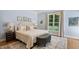 Bedroom with light blue walls, neutral carpet, and large window providing natural light at 321 Wescott Ridge Dr, Holly Springs, NC 27540