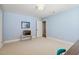 This light blue bedroom is carpeted and features a display of toy horses on a white table at 321 Wescott Ridge Dr, Holly Springs, NC 27540