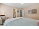 Comfortable bedroom with an en-suite bathroom and hallway access, featuring soft natural light at 321 Wescott Ridge Dr, Holly Springs, NC 27540
