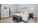 Bedroom featuring a plush rug, ottoman, and an ensuite at 321 Wescott Ridge Dr, Holly Springs, NC 27540