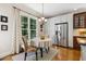Inviting breakfast nook featuring a window overlooking the backyard and modern stainless steel refrigerator at 321 Wescott Ridge Dr, Holly Springs, NC 27540