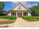 Attractive clubhouse featuring a covered entrance and landscaping, adding community charm at 321 Wescott Ridge Dr, Holly Springs, NC 27540