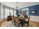 Inviting dining room featuring a chandelier, stylish decor, and large windows at 321 Wescott Ridge Dr, Holly Springs, NC 27540