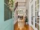 Spacious foyer with hardwood floors and a view into the living room with a staircase and lots of natural light at 321 Wescott Ridge Dr, Holly Springs, NC 27540