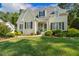 Inviting home with a well-manicured lawn and colorful landscaping, complemented by a classic light blue front door at 321 Wescott Ridge Dr, Holly Springs, NC 27540