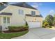 Exterior showcasing a well-manicured lawn, garage, and a home with great curb appeal at 321 Wescott Ridge Dr, Holly Springs, NC 27540