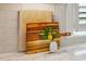 Modern decor with fresh flowers and wood cutting boards on the kitchen counter at 321 Wescott Ridge Dr, Holly Springs, NC 27540