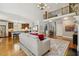 Open-concept living room and kitchen with hardwood floors, white trim, and lots of natural light at 321 Wescott Ridge Dr, Holly Springs, NC 27540